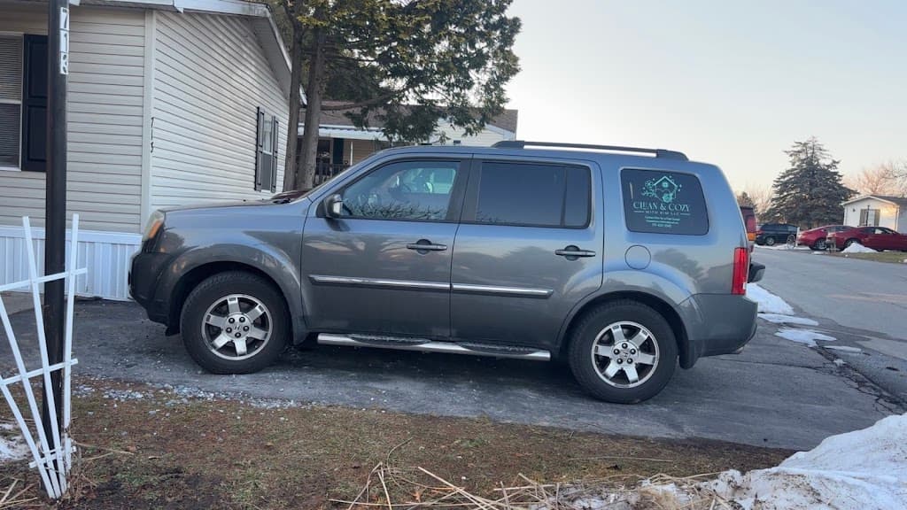 Clean & Cozy With Kim branded vehicle parked outside a York, PA home